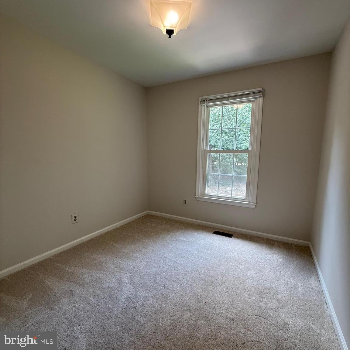 8442 Springfield Oaks Drive Springfield, VA 22153 - Photo 17 of 31 an empty room with a window