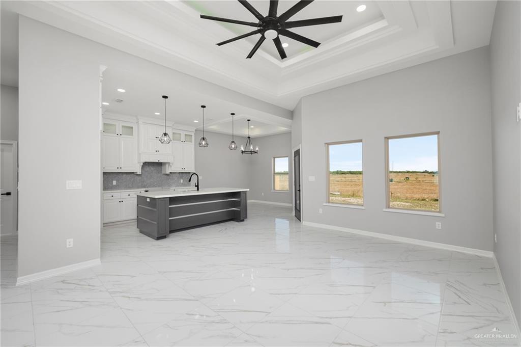 1614 Arden Street Mercedes, TX 78570 - Photo 3 of 17 a living room with stainless steel appliances kitchen island granite countertop furniture and a fireplace
