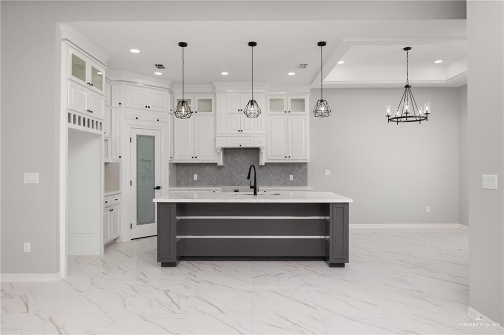 1614 Arden Street Mercedes, TX 78570 - Photo 4 of 17 a view of kitchen with stainless steel appliances kitchen island sink and refrigerator