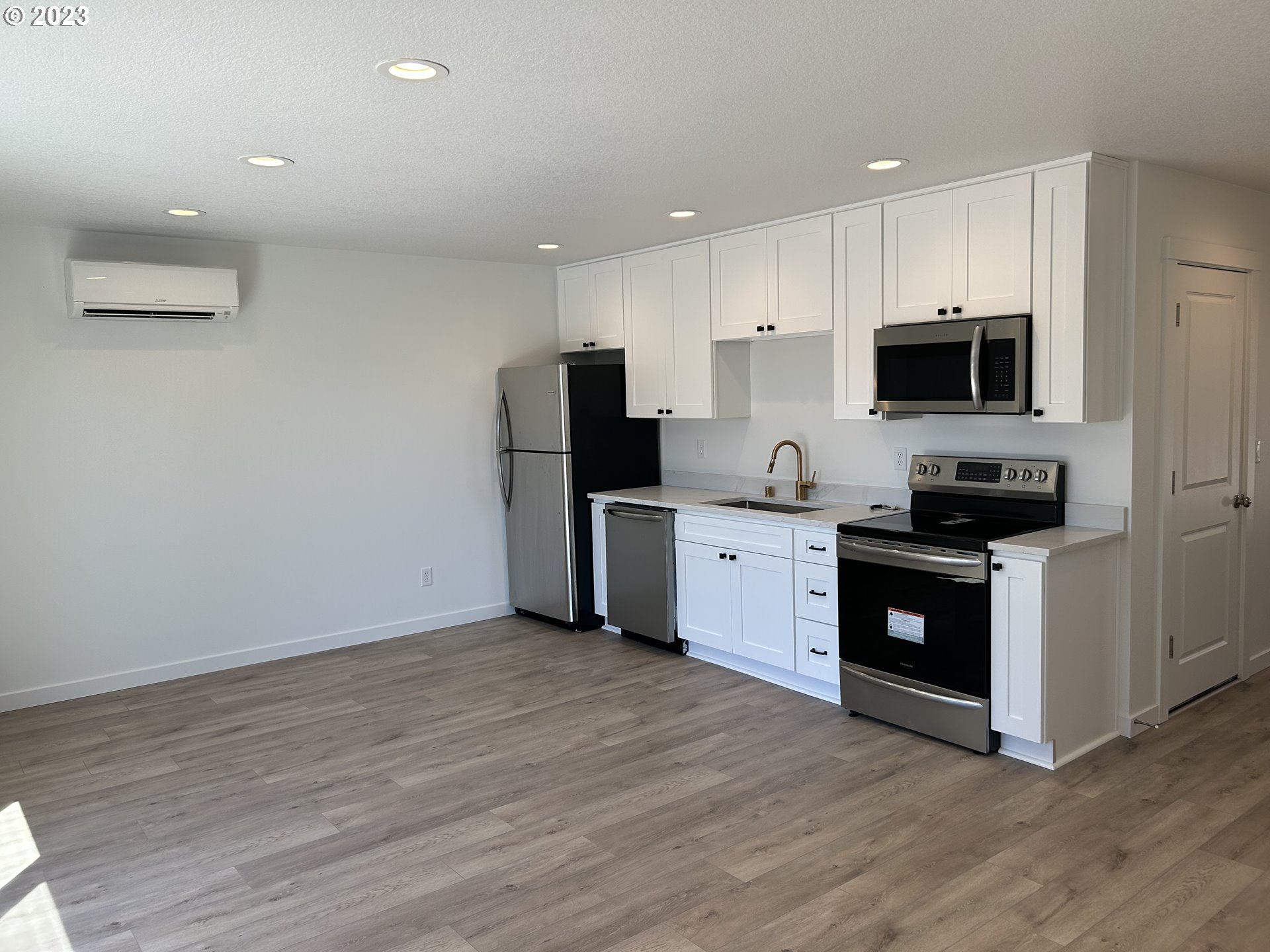 1006 Peach Road Winlock, WA 98596 - Photo 11 of 15 a kitchen with granite countertop a refrigerator and a stove top oven
