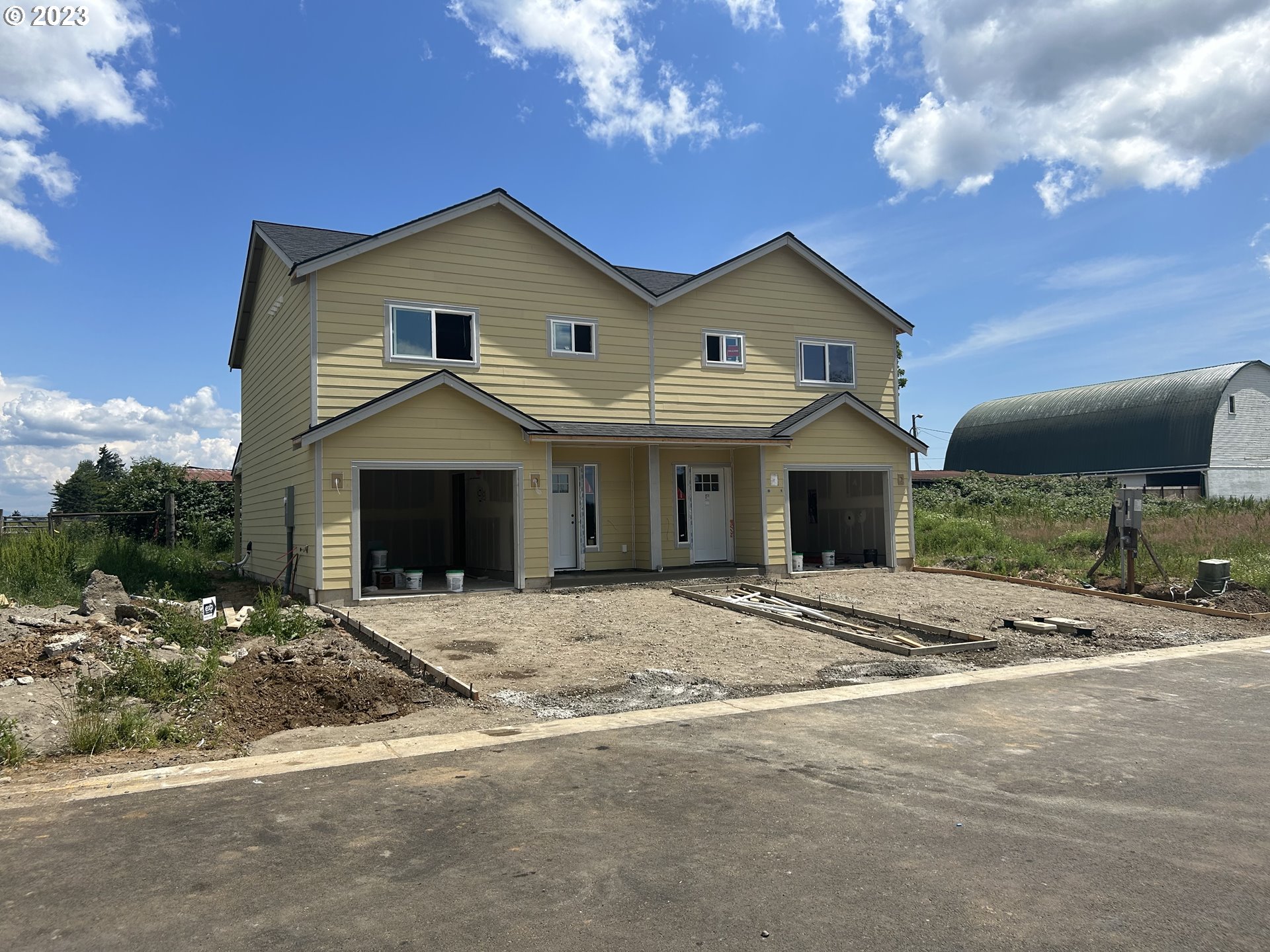1006 Peach Road Winlock, WA 98596 - Photo 3 of 15 a front view of a house with yard and parking