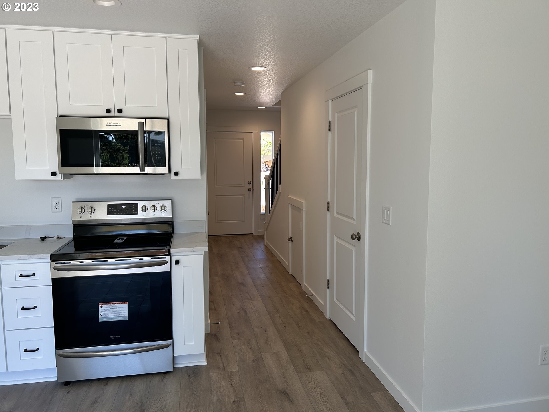 1006 Peach Road Winlock, WA 98596 - Photo 10 of 15 a kitchen with stainless steel appliances a stove top oven and cabinets