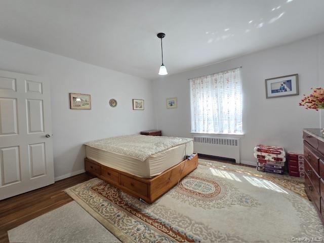 46 Grace Avenue, Unit 2J Great Neck, NY 11021 - Photo 16 of 20 a bedroom with a bed dresser and a window