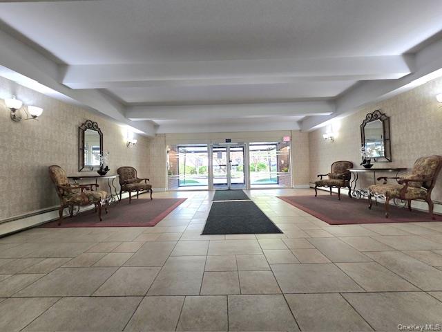 46 Grace Avenue, Unit 2J Great Neck, NY 11021 - Photo 6 of 20 a lobby with furniture and a large window