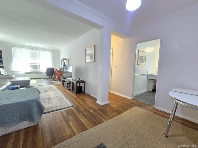 46 Grace Avenue, Unit 2J Great Neck, NY 11021 - Photo 7 of 20 a living room with furniture and a table