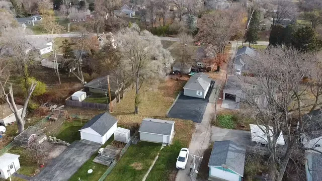 an aerial view of multiple house with outdoor space