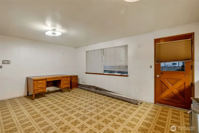 a view of a kitchen with a sink and a refrigerator
