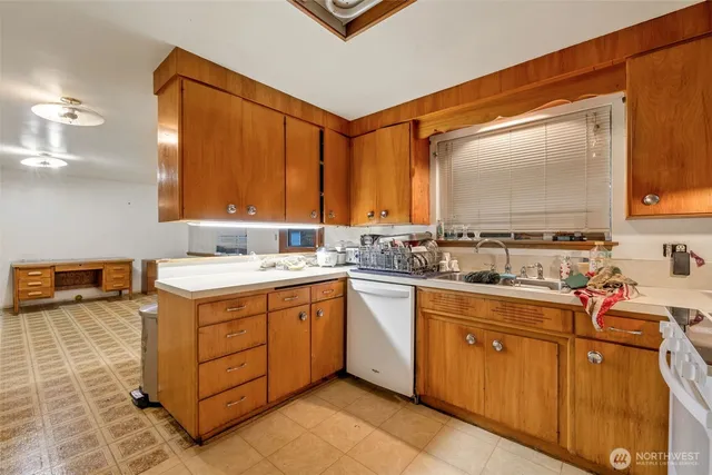 a kitchen with a refrigerator and cabinets