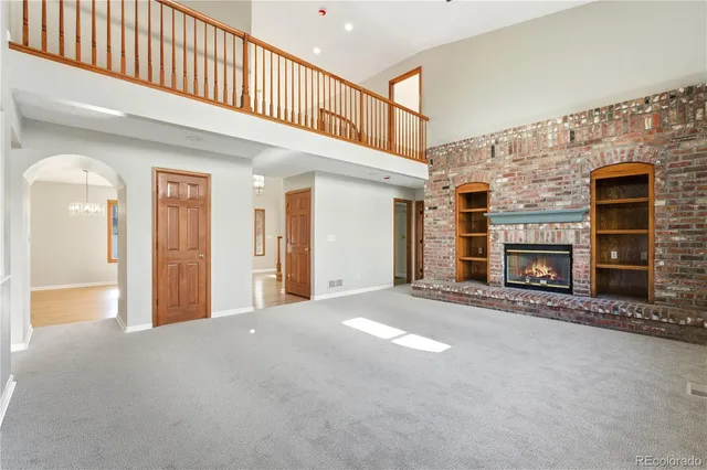 a large kitchen with stainless steel appliances and a refrigerator
