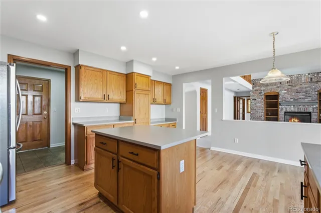 a bathroom with a granite countertop sink a mirror and shower