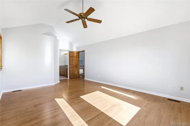 a bathroom with a sink and mirror with toilet