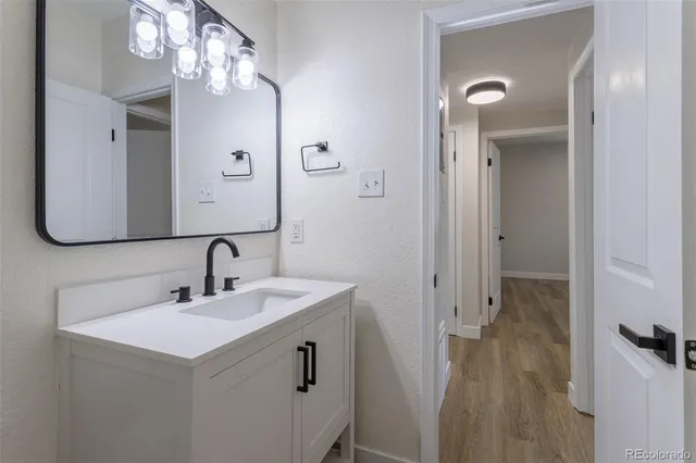 a bathroom with a sink double vanity and a mirror