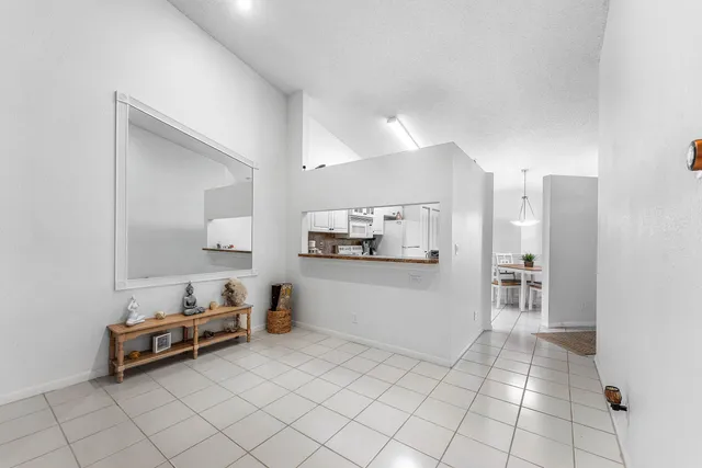 a room with furniture and white walls