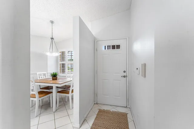a view of a room with furniture and windows