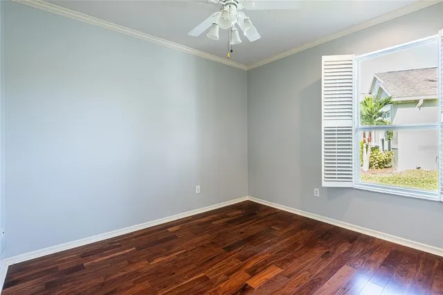 a bathroom with a granite countertop toilet sink and mirror