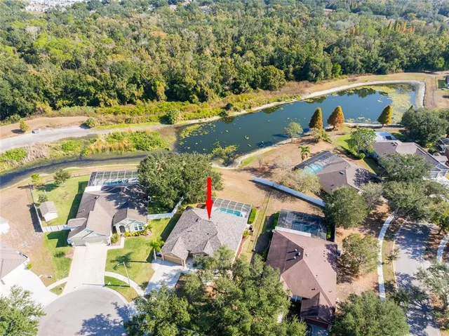 an aerial view of a house with a swimming pool