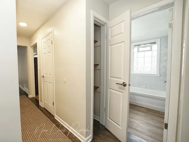 a view of a bathroom from the closet