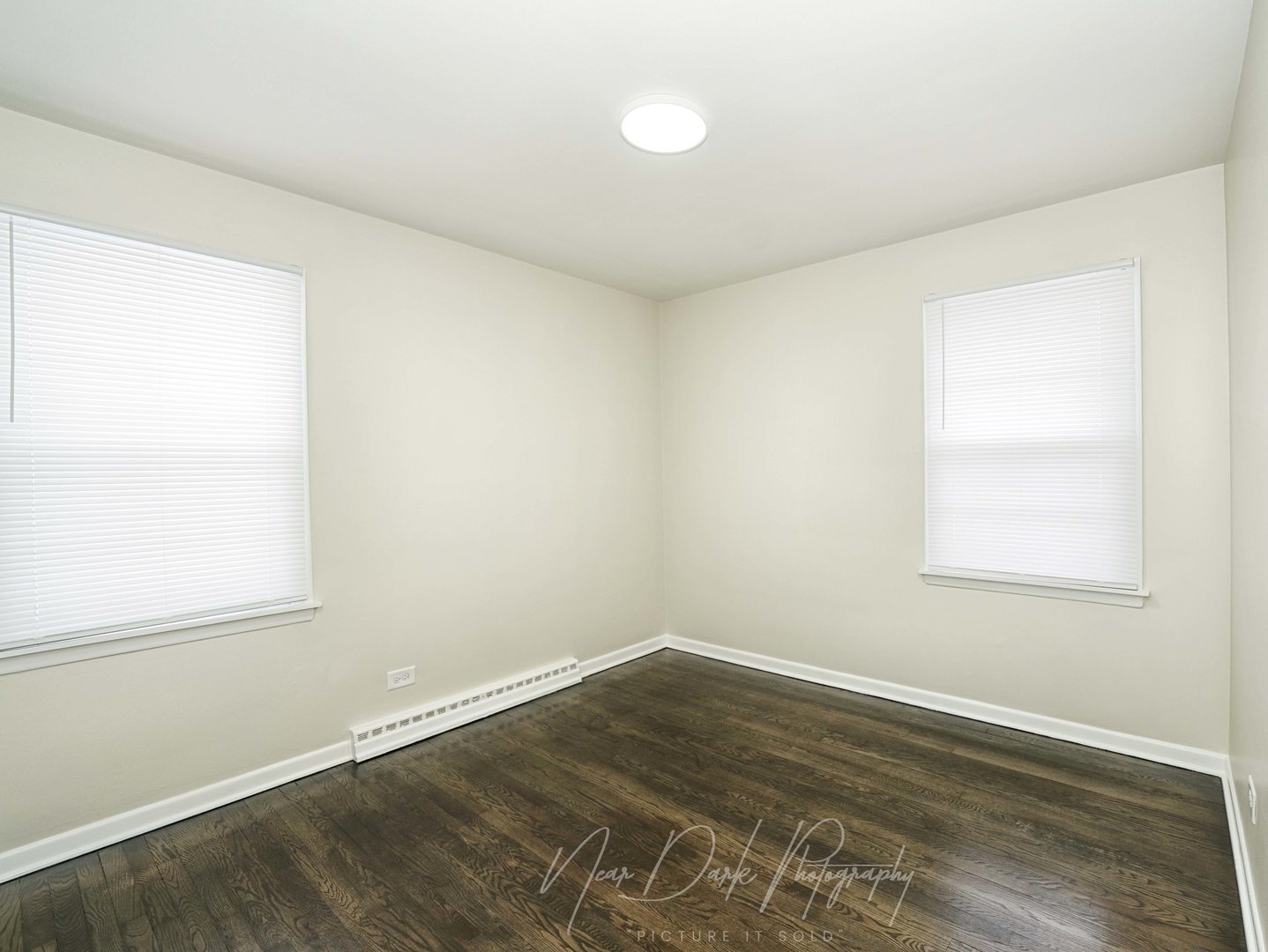 37684 North Sheridan Road Beach Park, IL 60087 - Photo 15 of 27 an empty room with wooden floor and windows