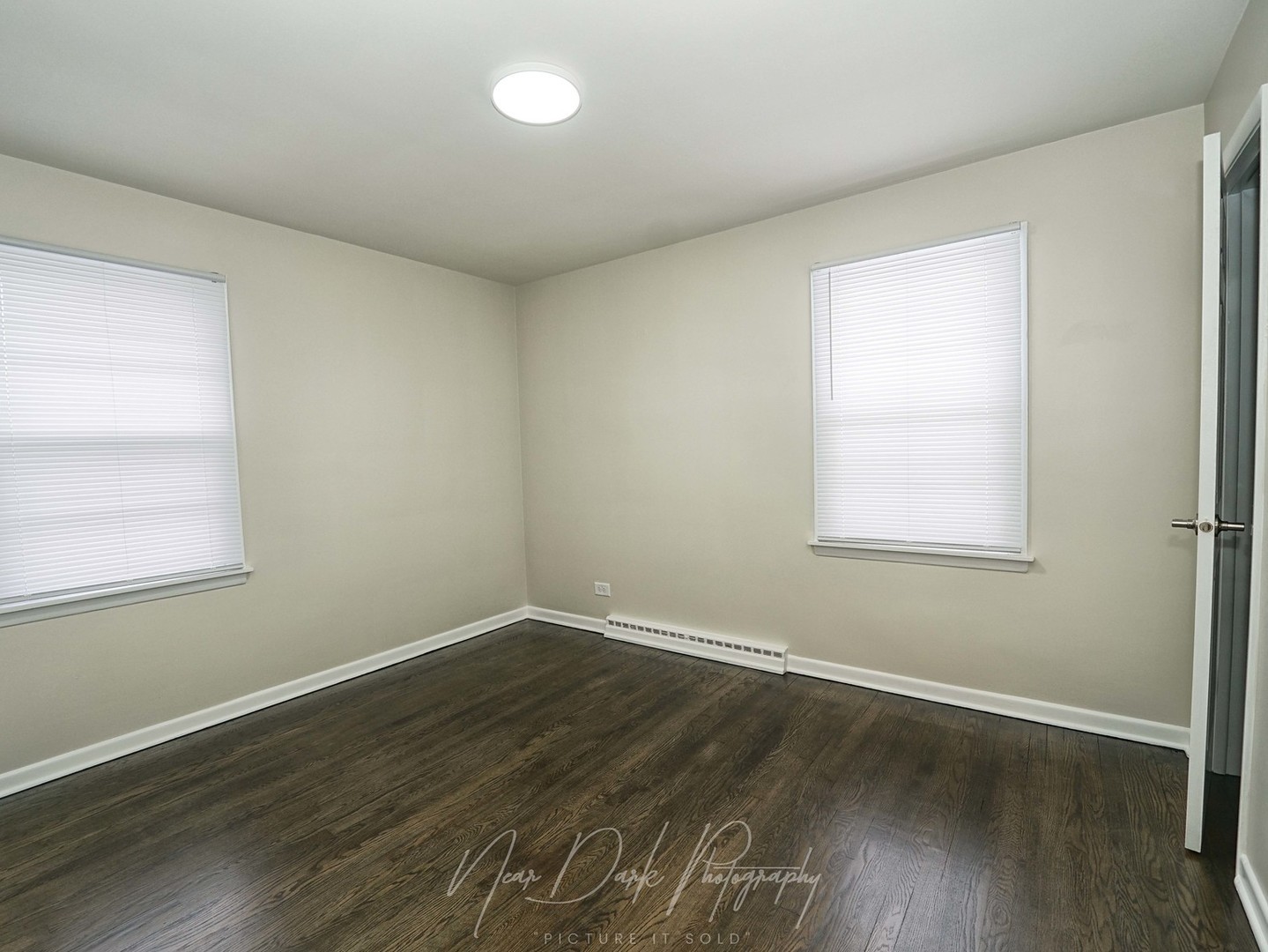 37684 North Sheridan Road Beach Park, IL 60087 - Photo 17 of 27 an empty room with wooden floor and windows