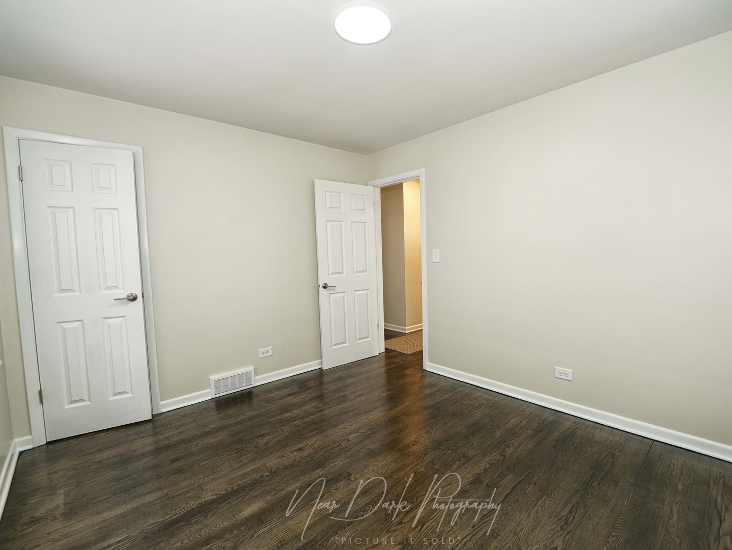 37684 North Sheridan Road Beach Park, IL 60087 - Photo 18 of 27 a view of an empty room with wooden floor