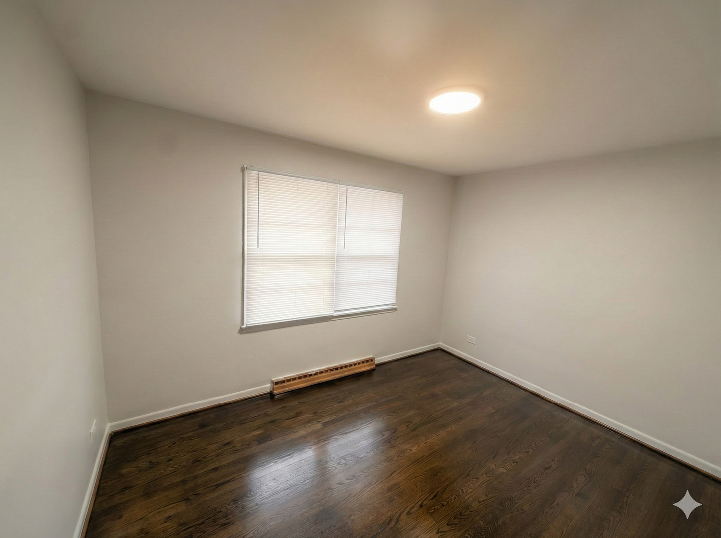 37684 North Sheridan Road Beach Park, IL 60087 - Photo 19 of 27 an empty room with wooden floor and windows