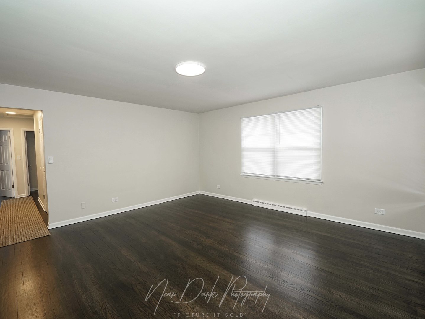 37684 North Sheridan Road Beach Park, IL 60087 - Photo 5 of 27 an empty room with wooden floor and windows