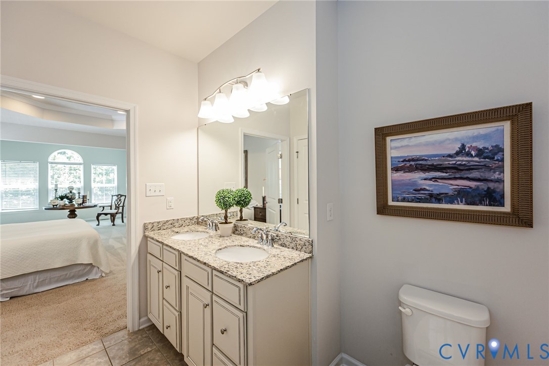 7435 Wicks Road Williamsburg, VA 23188 - Photo 48 of 82 Primary Bathroom featuring a dual vanity with gran