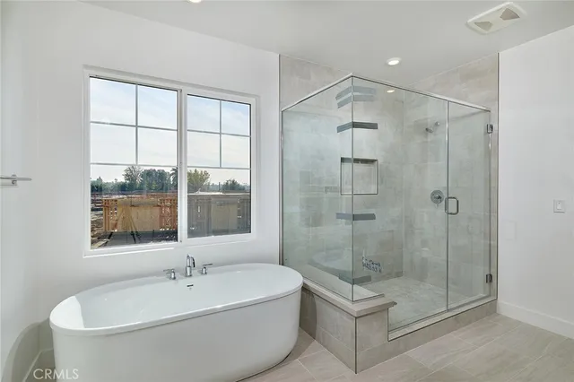 a bathroom with a bathtub and shower