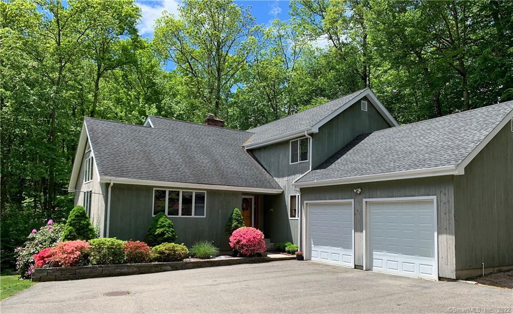 a front view of a house with yard