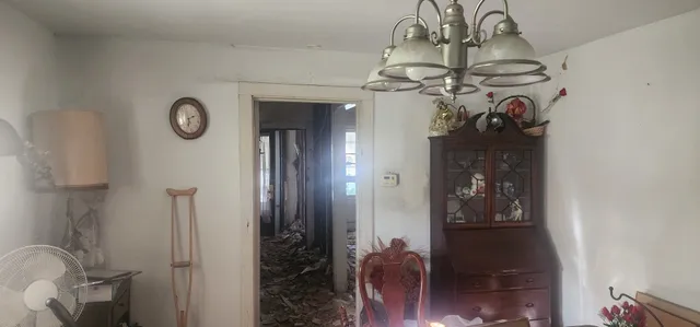 a view of a hallway with a chandelier