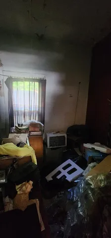 a bed sitting in a room next to a window