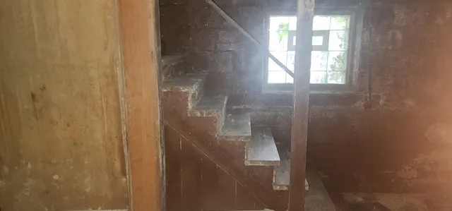 a view of hallway with furniture