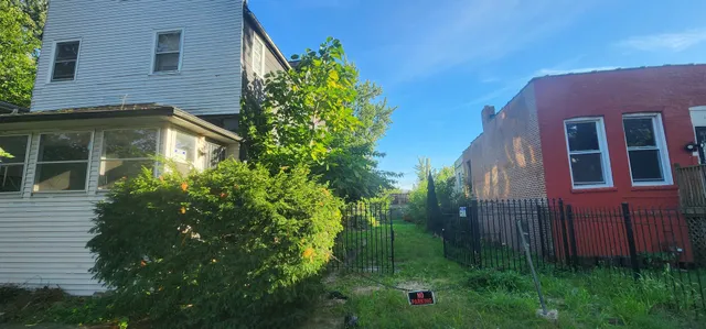 a brick building with a yard