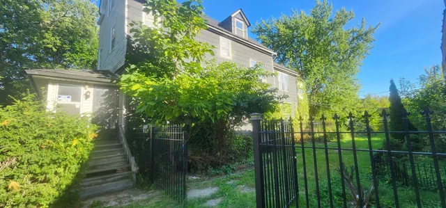 a backyard of a house with lots of green space