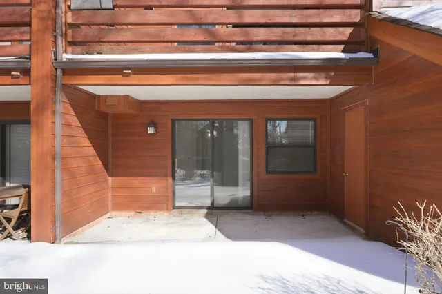 a view of a backyard with wooden fence