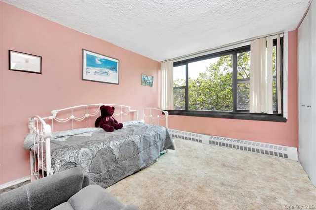 a bedroom with a large bed and a large window