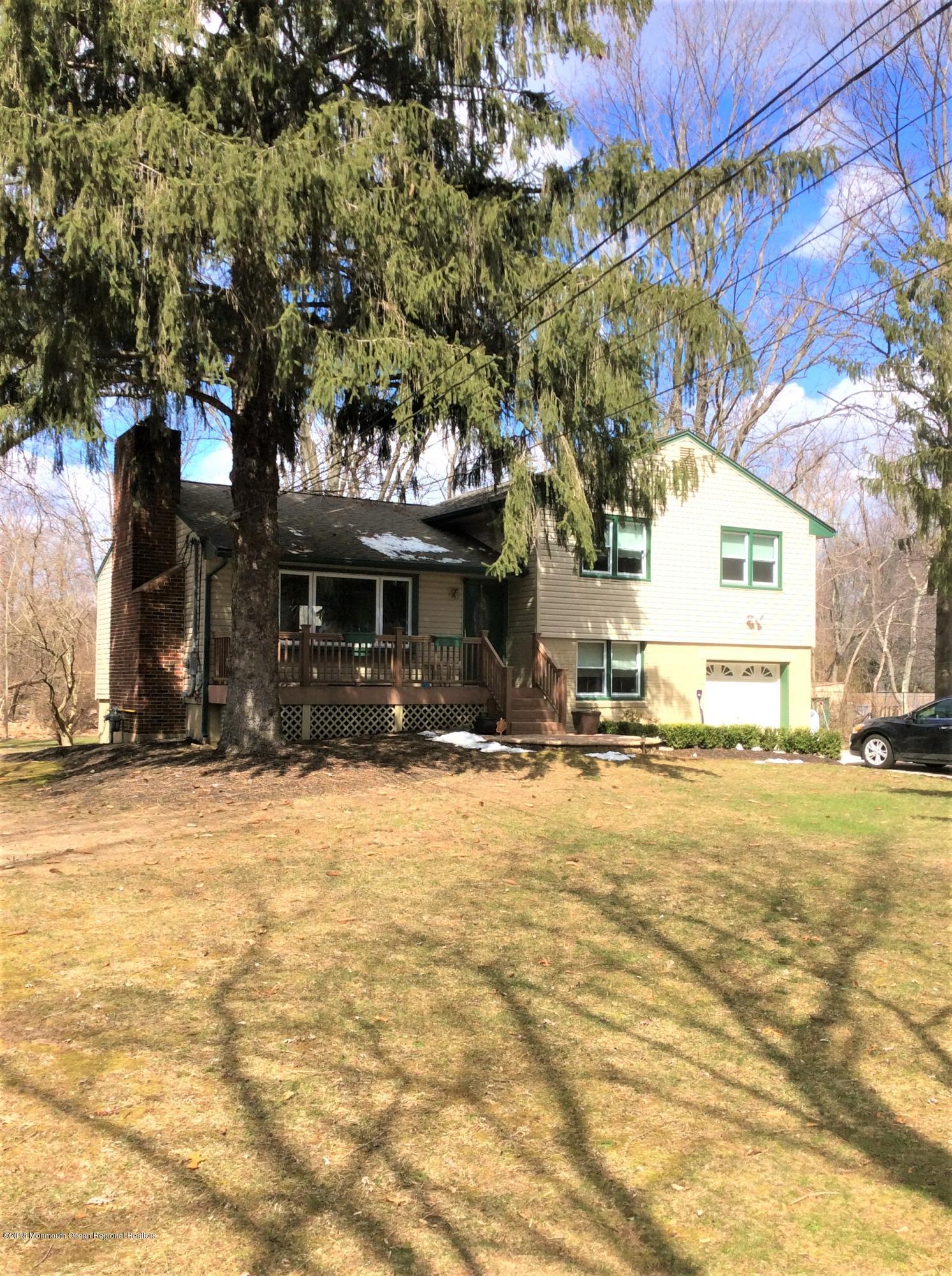 224 Old Mill Road Freehold, NJ 07728 - Photo 1 of 25 a front view of a building with street