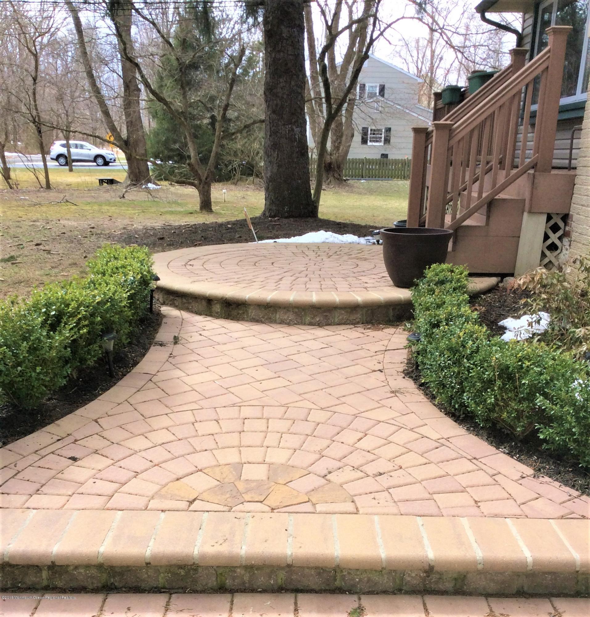 224 Old Mill Road Freehold, NJ 07728 - Photo 3 of 25 a view of a yard with buildings