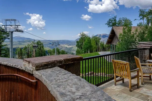 a view of a roof deck with couches