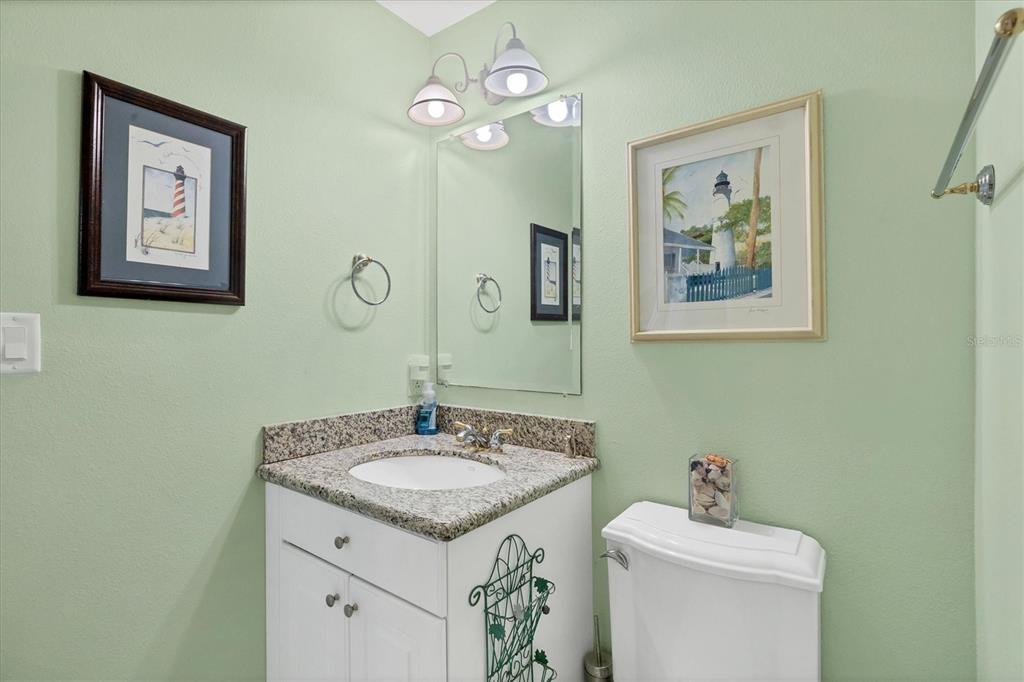 9203 Griggs Road, Unit A302 Englewood, FL 34224 - Photo 26 of 42 a bathroom with a sink vanity and toilet