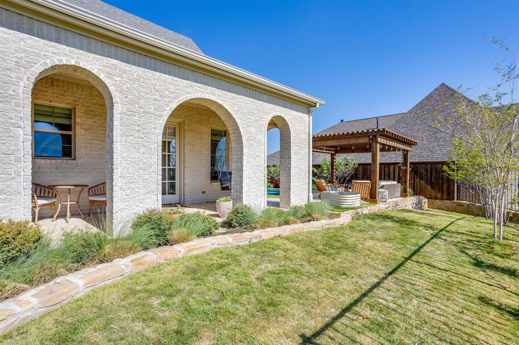 14000 Rozana Street Fort Worth, TX 76008 - Photo 32 of 38 a house view with a garden space
