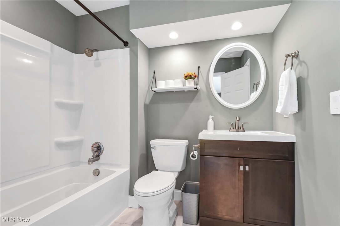 5141 Jaycox Road North Ridgeville, OH 44039 - Photo 20 of 36 Full bathroom with shower / bathtub combination, vanity, and toilet