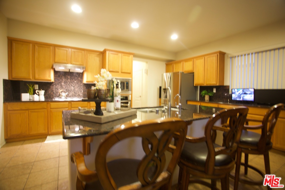 1401 Wild Olive Road Tehachapi, CA 93561 - Photo 5 of 7 a kitchen with lots of counter top space