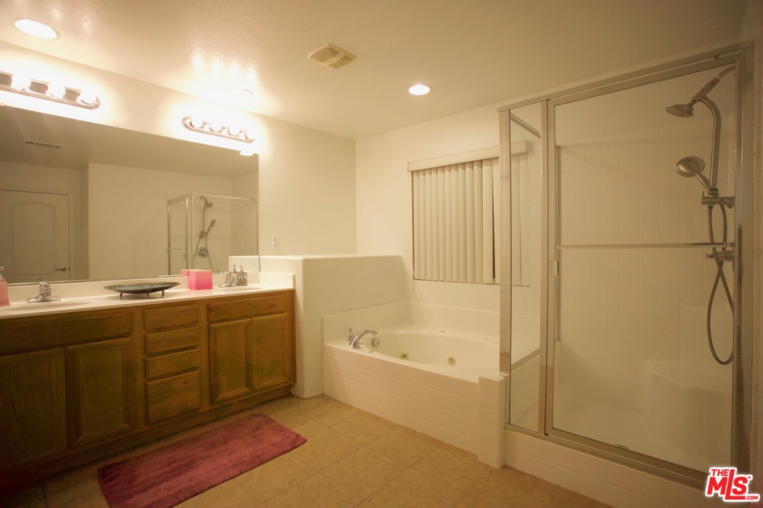 1401 Wild Olive Road Tehachapi, CA 93561 - Photo 7 of 7 a bathroom with a tub sink shower and mirror