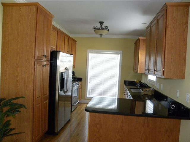 407 Conquest Road Murfreesboro, TN 37128 - Photo 3 of 20 Kitchen has gorgeous black granite and stainless steel appliances