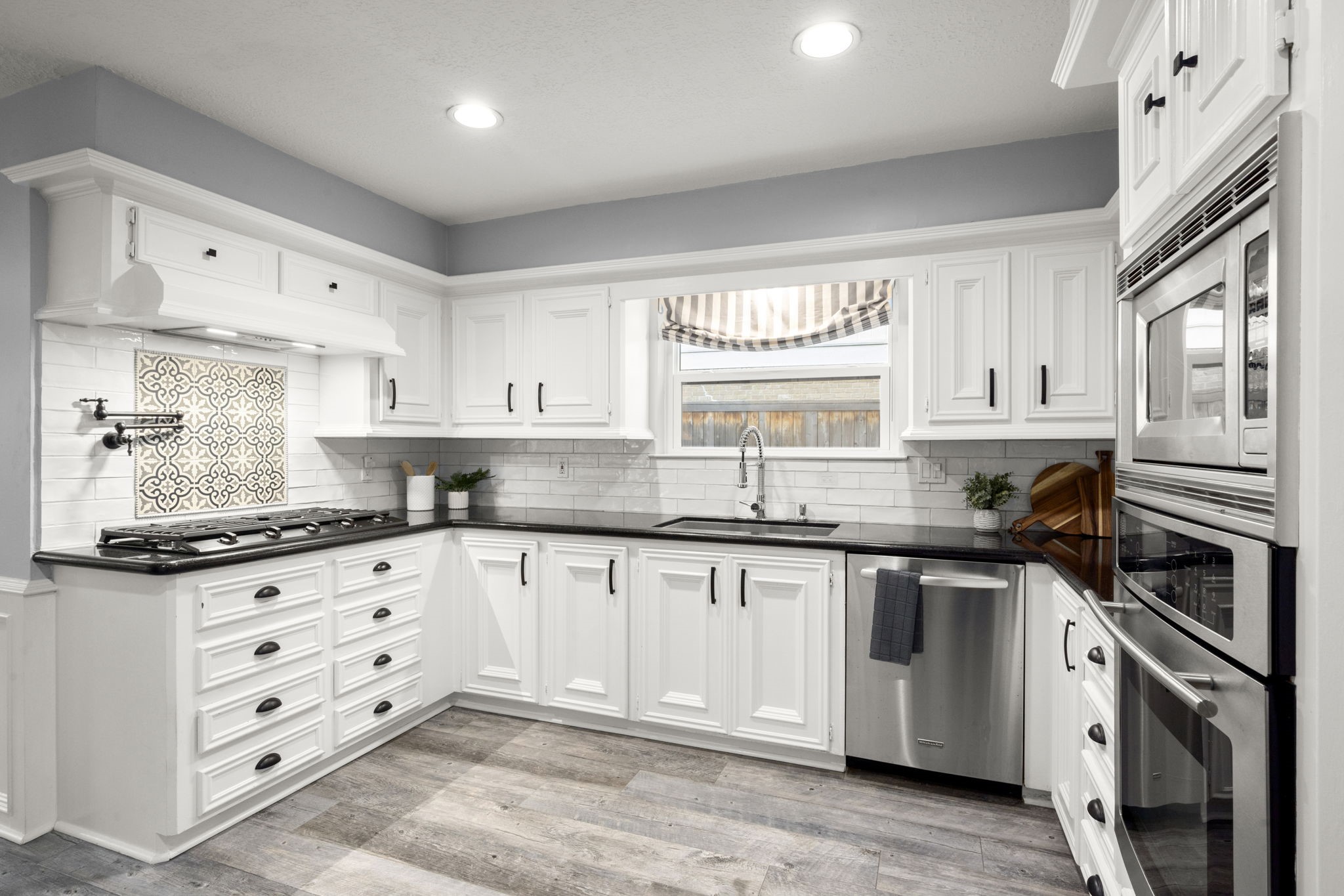 16111 Maplehurst Drive Spring, TX 77379 - Photo 11 of 30 a kitchen with granite countertop a sink stainless steel appliances and cabinets