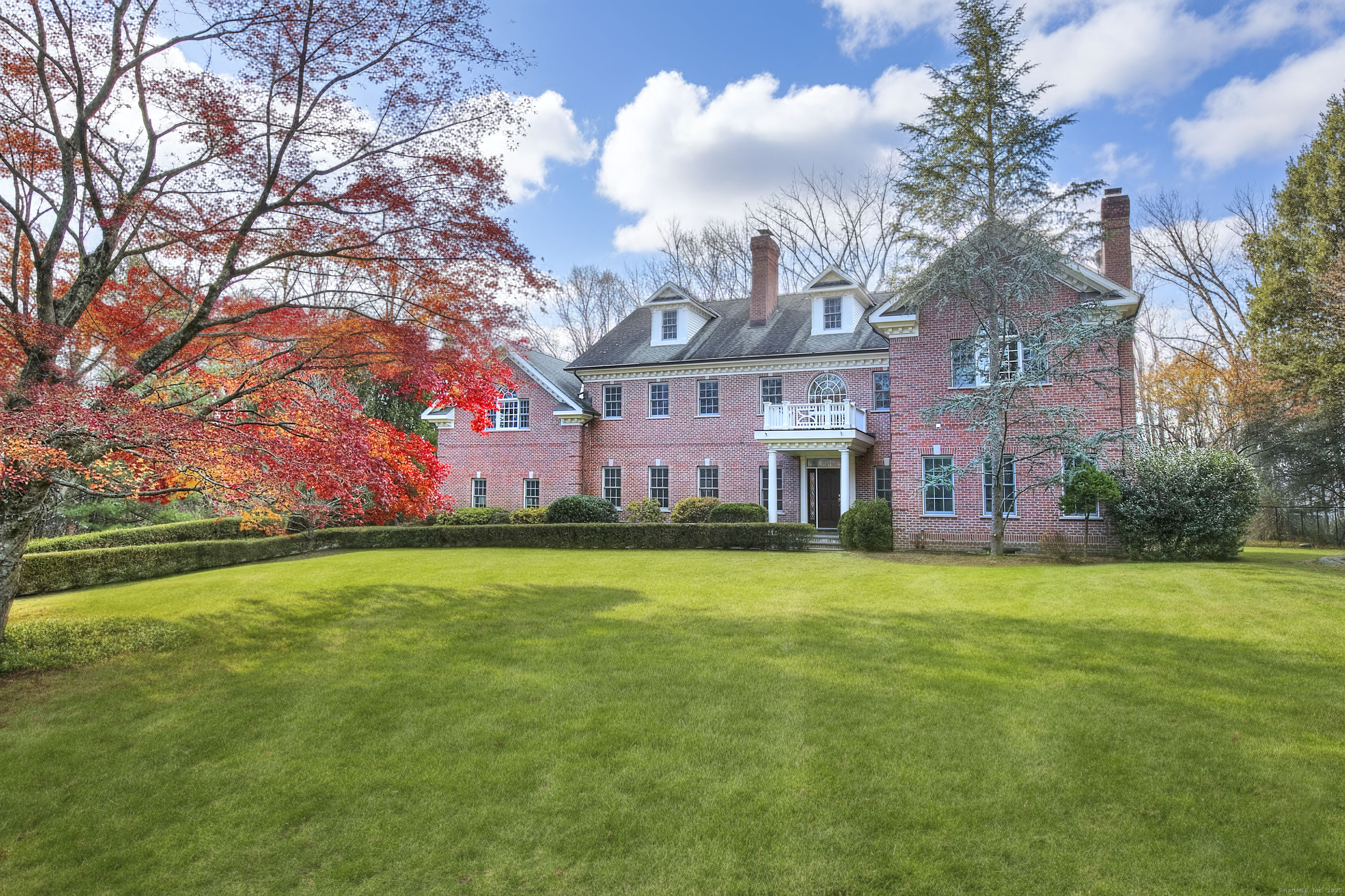 49 Pinner Lane Stamford, CT 06903 - Photo 1 of 1 a man standing with a big yard