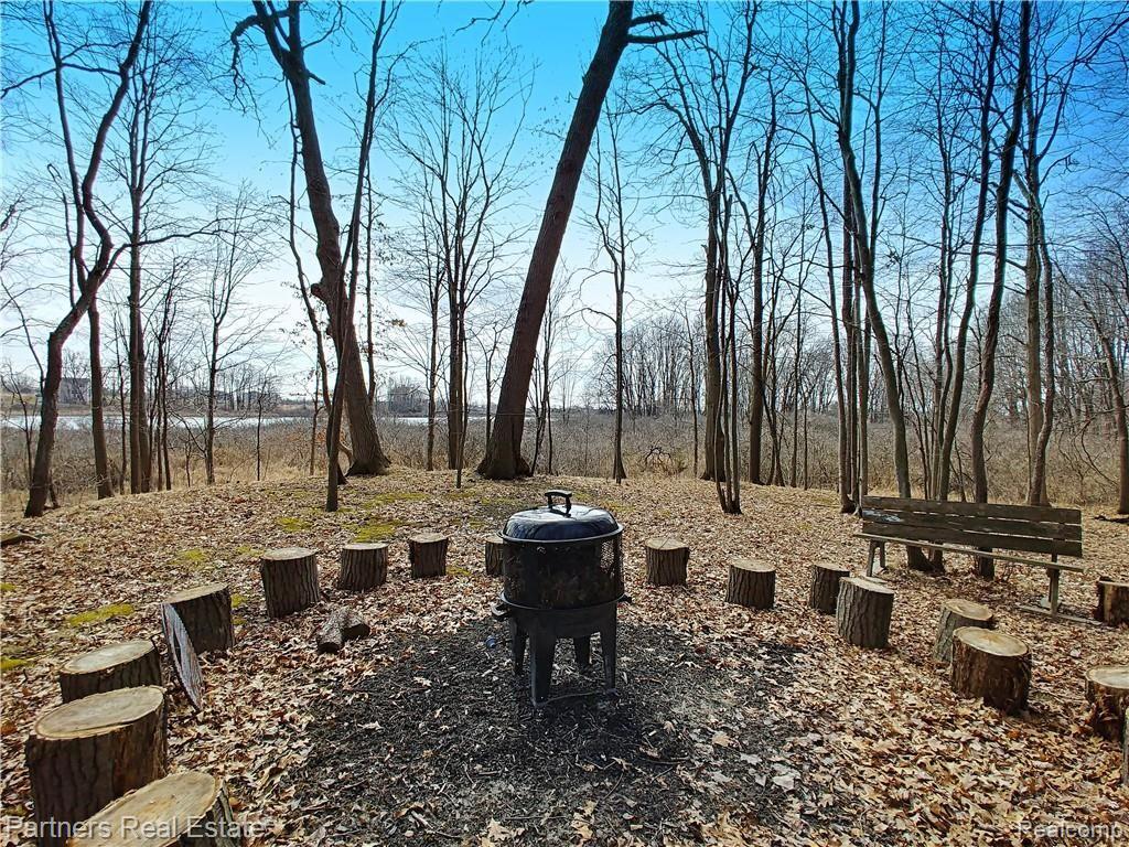 2715 West Coon Lake Road Howell, MI 48843 - Photo 45 of 54 17f3. Enjoy an Outdoor Fire with Friends