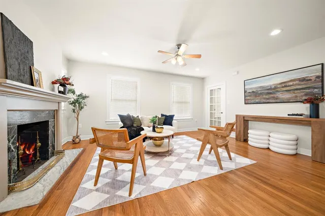 a living room with furniture and a fireplace