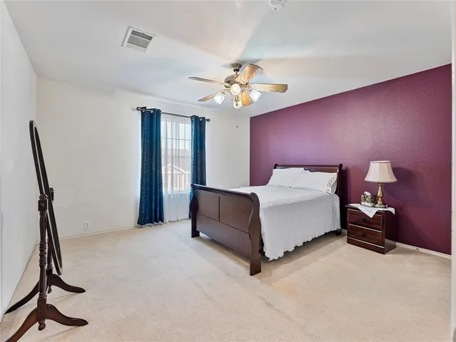 a bed room with a bed and a chandelier